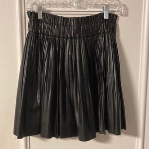 Black platter, pleated miniskirt